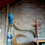 Installing the willow sculpture at All Saints'