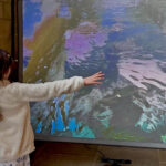 Young visitor with Laura Dekker's interactive video. Watershed at All Saints'.