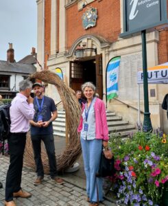 Angela Mellen with her willow sculpture at the River Summit 2026, Henley UK.